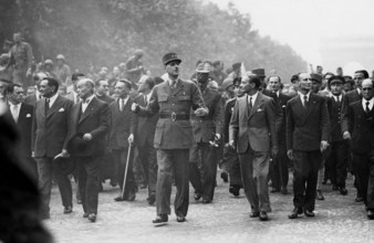 General de Gaulle walking down the Champs-Elysées, at the Liberation of Paris (August 1944)