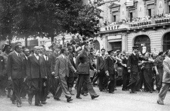 General de Gaulle walking down the Champs-Elysées, during the Liberation of Paris (August 1944)