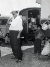 Gypsy people before a caravan