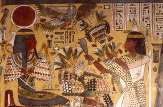 Scene of libation and offering the bouquet brought up to Amon-Ra by the priest Sem, dressed in a panther skin