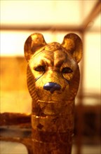 Object from the tomb of Tutankhamon: Lion's head on one of the sides of the bed