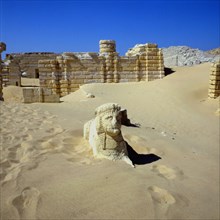 The site of Medinet Madi buried beneath the sands: a sphinx with the head of a pharoah