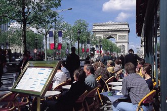 Sidewalk café on the Champs-Elysées, tourists