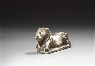 Figurine représentant un lion couché