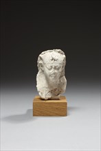 Egyptian sculptor's model figuring the head of a king