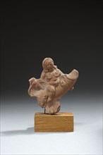 Statuette représentant une femme nue chevauchant un phallus démesuré