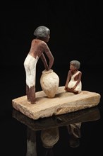 Egyptian model of a woman and a seated child
