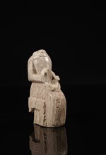 Near Eastern statuette of a seated man on a throne