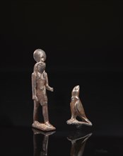 Egyptian votive statuette and figure of the god Horus