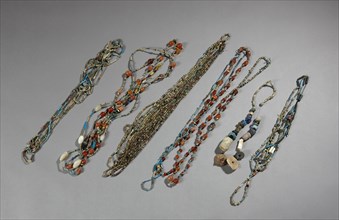 Beads assembled in necklaces