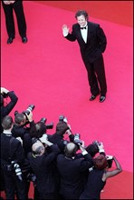05/09/2001. 54th Cannes Film Festival: Francis Huster walking up the stairs.