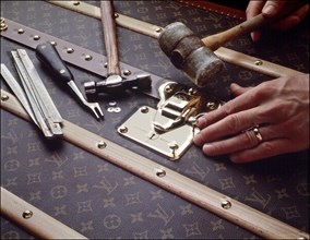 00/00/2001.  Close-up on luxury luggage Patrick Louis Vuitton in his workshop.