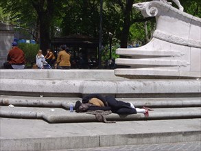A homeless person in Central Park South in in New York
