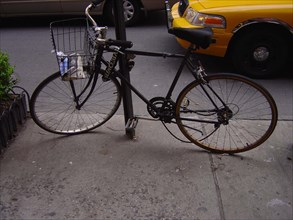 Bike and yellow cab in New York