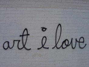 Gaffiti "art I love" on a facade in New York