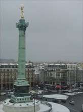 Bastille square under the snow in Paris