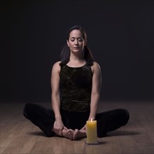Young woman in yoga position.