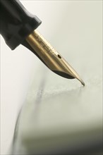 Signing with a fountain pen.