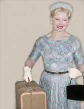 A retro woman leaving on a trip.