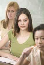 Young women in college classroom.