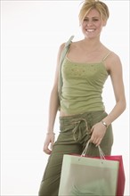 Confident woman with shopping bags.