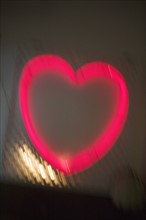 Glowing pink heart.