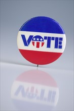 A pin urging people to vote.