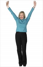 A woman standing with arms outstretched.
