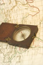 Closeup of a map and compass.
