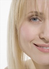 Partial view of smiling woman's face.