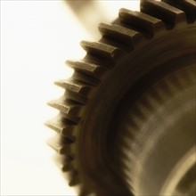 Closeup of large gears in motion.