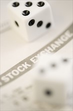 Dice with stock exchange paper.