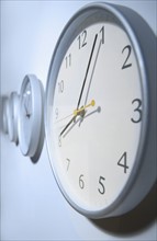Closeup of clock on wall.