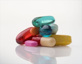 Closeup of pile of multi-colored pills.