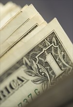 Closeup of corners of dollar bills.