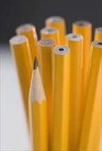 Unsharpened pencils with one sharpened.