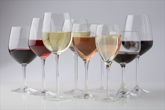 Closeup of glasses of different wines.