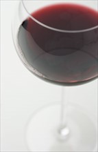 Closeup of glass of red wine.