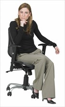 Woman sitting in chair.