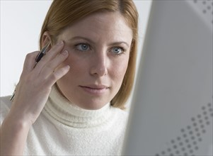 Woman focused on her computer.