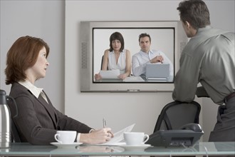 Businesspeople in videoconference.