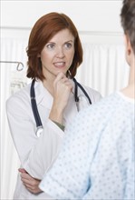 Female doctor talking with patient.