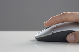 Profile of hand on mouse.