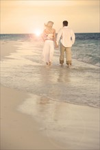 Couple strolling the beach.
