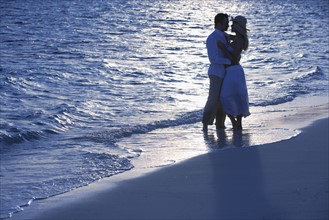 Romantic couple on beach.