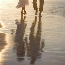 Couple strolling the beach.