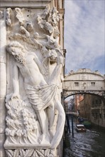 The Bridge of Sighs with sculpture depicting Drunkenness of Noah Doge's Palace Venice, Italy.