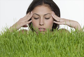 Stressed woman with long grass.