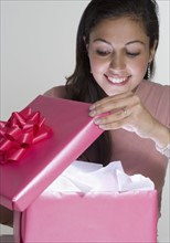 Woman opening present.