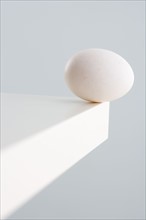Egg at corner of table.